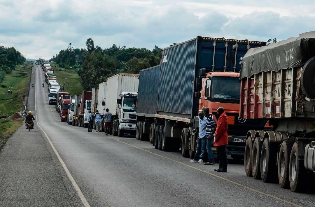 Freight trucks queuing along a regional highway